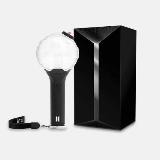 A fan holding the BTS Army Bomb Lightstick Ver.3 Map of The Soul edition, showing its ergonomic design and comfortable grip.