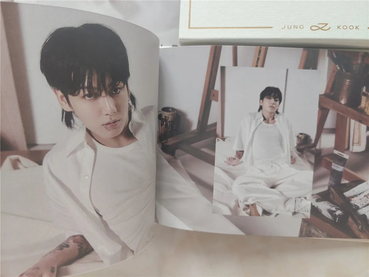 Photobook from BTS Jungkook's solo album 'GOLDEN,' containing exclusive photos and behind-the-scenes images.