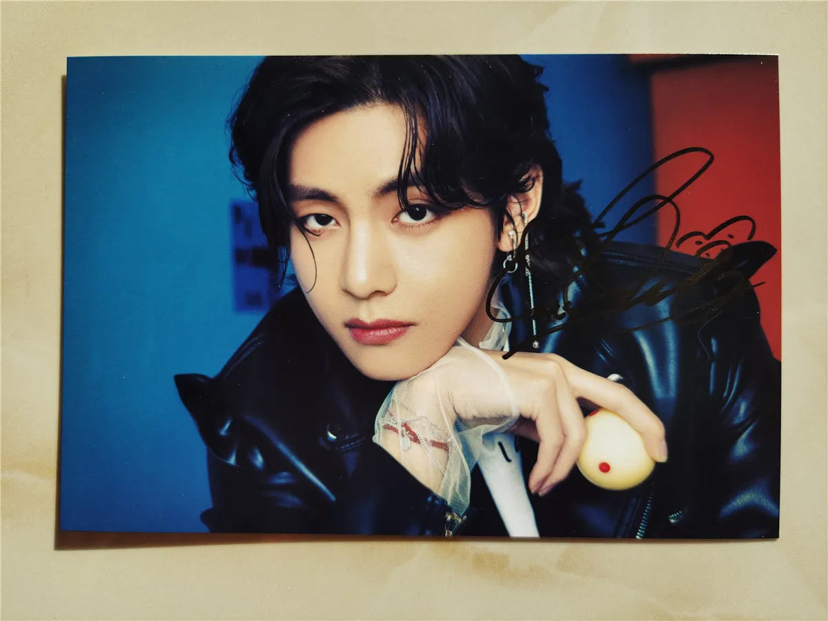 High-definition photo of V from BTS with his genuine hand signature in real ink