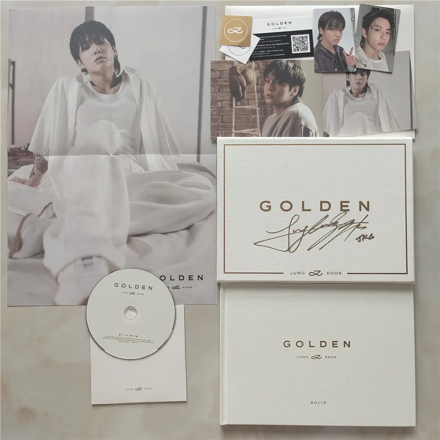 Signed cover of BTS Jungkook's solo album 'GOLDEN,' featuring Jungkook's autograph.